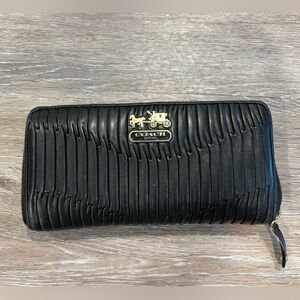 Coach black wallet with gold accents